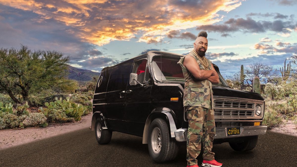 Mr. T standing in front of a car looking cooler than everybody.